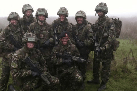 A group in camouflage uniforms during Army training